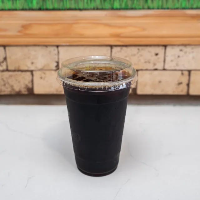 A cup of iced drip coffee on the counter